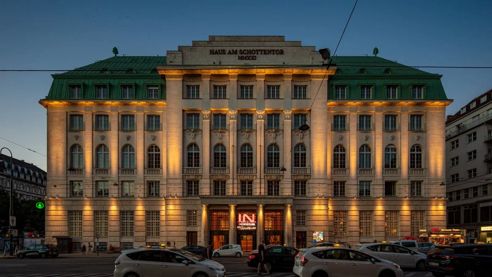 Illuminated facade of Haus am Schottentor at night
